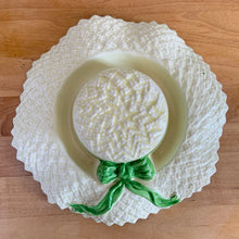 Load image into Gallery viewer, Delightful vintage pale yellow straw hat with green bow ceramic posy vase. Crafted by Falcon Ware, England, 1940s. Fill will flowers to create a charming floral centrepiece.

In excellent condition, no chips/cracks/repairs.

Measures 8 1/2 x 2 1/4 inches
