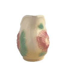 Load image into Gallery viewer, Vintage mid-century Sun Glow pale yellow ceramic pitcher with embossed pink dogwood flowers on a on pale yellow ground. Crafted by Hull, USA, circa 1950s. A great way to add charm to your tableware.

In as found vintage condition, chip to the foot, no cracks/repairs. Marked.

Measures 7 x 3 3/4 x 5 3/8 inches

Capacity 24 ounces
