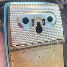 Load image into Gallery viewer, Fabulous vintage turquoise and gold Sunbeam Mixmaster hand mixer, model HM. Crafted by the Sunbeam Corporation, Canada, 1957. The mixer is in the original box with 2 beaters and instruction/recipe booklet and has the original packing slip on the outside of the box in an envelope. A must-have for any baker or appliance collector!

In good vintage condition. Tested and in good working order.
