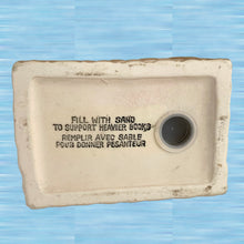 Load image into Gallery viewer, Bottom view of vintage tabby cat ceramic bookend showing hollow construction and sand-fill stopper, Japan

