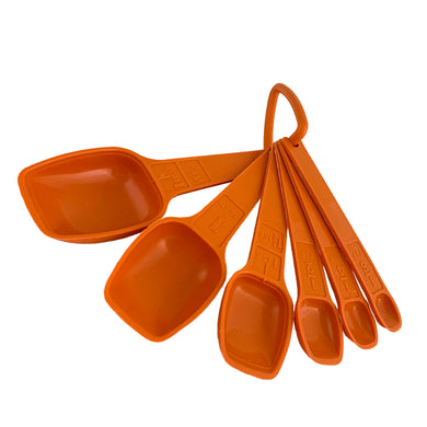 Vintage orange measuring spoon set. Crafted by Tupperware, 1970s.
There are seven spoons ranging from 1/8 teaspoon up to 1 tablespoon and each attaches to a ring to keep them organized. The perfect gift for any Tupperware collector, baker or cook.

In good used condition.

Part numbers range from 1268-4 to 1272-4