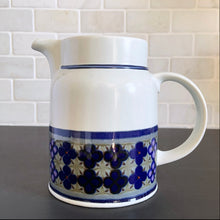 Load image into Gallery viewer, Vintage 32 Ounce Pitcher in the Tangier pattern. Features a Moroccan-style geometric floral pattern in shades of purple, green, and deep blue on a light gray ground. Lambeth Stoneware. Overall excellent condition, free from chips/cracks with normal age-related wear. The exception is the Casserole with a chip to the rim and underside of one handle. Marked &quot;Lambeth Stoneware, Royal Doulton, Tangier, L.S.1005, Made in England, Dishwasher Proof, Detergent Proof, Freezer &amp; Oven Proof, © 1973.
