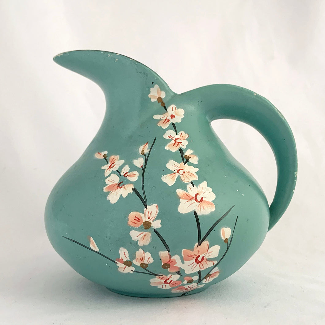 Vintage art deco style teal pitcher vase, hand painted with branches and pink flower blossoms, glazed black on the interior. Produced by Brentleigh Ware, England, circa 1930s. This small pitcher has big style with strong lines!  In great vintage condition, free from chips/cracks/repairs, very minor glaze loss on the rim and handle. Marked 