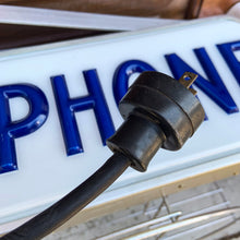 Load image into Gallery viewer, Fabulous find!!! Vintage electric lighted telephone sign with metal wall bracket for ease of hanging. The cobalt blue raised lettering is molded white plastic. Crafted by Brouillette Signs Ltc. Montreal Canada, circa 1940s. This sign was sourced from the estate of the Dale family pharmacy in downtown Toronto Canada. A great piece of Canadian advertising craftsmanship.
