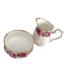 Load image into Gallery viewer, Vintage The Old Country Countess shaped creamer and sugar features a lovely pattern of roses in shades of pink and green with gold gilt details at the rims and handle. Crafted by Royal Albert, England between 1950s - 1960s. A lovely addition to your tableware collection!  In excellent condition, no chips/cracks/repairs. Maker&#39;s marks present.  Creamer measures 2 1/2 x 3 1/4 inches  Sugar measures 3 1/4 x 2 inches
