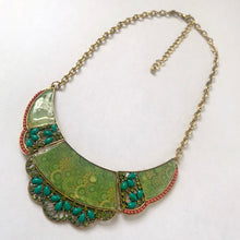 Load image into Gallery viewer, Vintage Tibetan-style tiered bib necklace with emerald enamel crescent pendant, green rhinestones, turquoise and coral beads on gold-tone chain

