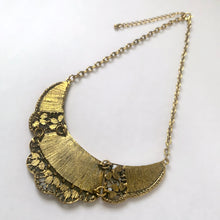 Load image into Gallery viewer, Back view of vintage Tibetan-style bib necklace showing tiered construction and gold-tone chain
