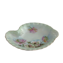 Load image into Gallery viewer, An exquisite vintage hand painted porcelain dish featuring the delicate To A Wild Rose pattern (model 2602). Crafted by Lefton, Japan 1950s. This kidney-shaped dish showcases intricate botanical motif in soft, naturalistic hues and gold rim, making each piece genuinely one-of-a-kind. Ideal for collectors of vintage tableware, decorative display, or as a refined accent piece, this dish exemplifies the quality and aesthetic refinement that defined Lefton's legacy. Perfect for holding trinkets, nuts or mints.
