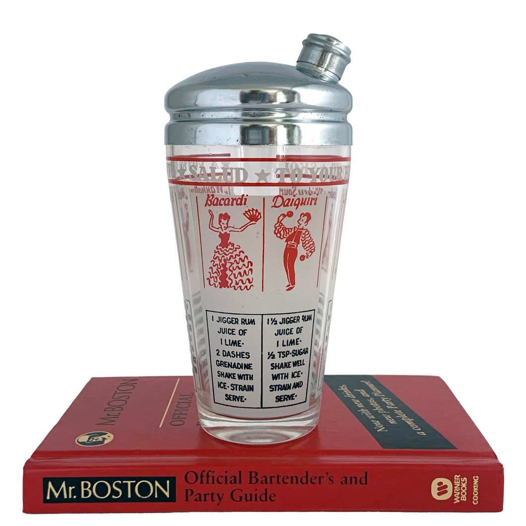 Vintage mid-century glass cocktail shaker featuring 6 classic cocktail recipes in black with illustrated figures in red on a frosted panel, accented with a border of red stripes with 