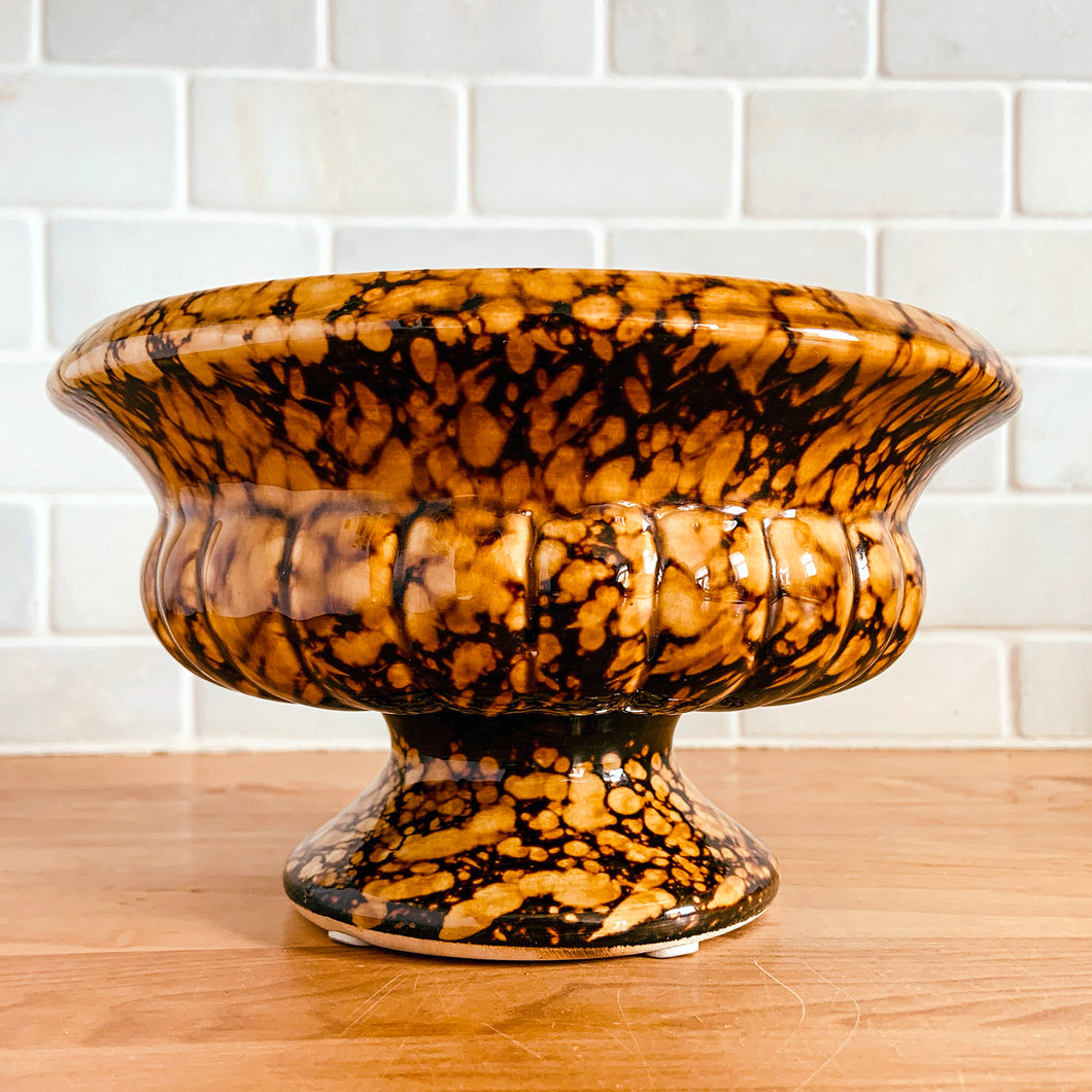 Vintage style tortoiseshell glazed ceramic pedestal planter in the shape of a classic wide urn. A great home for houseplants and succulents or repurpose as a catchall or candy bowl.  In excellent condition, free from chips/cracks/repairs.  Measures 7 1/4 x 4 1/8 inches 