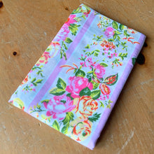 Load image into Gallery viewer, Lovely vintage Truprest poly cotton pillowcase printed with pink and yellow roses on beige bands with pink and white stripes. Crafted by Texmade, Canada, 1970s. A beautiful addition to your shabby chic decor, cottage bedding collection, or repurpose for crafting.

In excellent like-new condition, no stains/tears. Colours are vibrant.

Measures 32 x 20 1/2 inches
