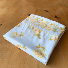 Load image into Gallery viewer, Lovely vintage Truprest yellow Rose Romance poly cotton queen size flat bed sheet featuring roses in shades of yellow with pale blue and green leaves finished with yellow trim at the band. Crafted by Texmade, Canada, 1973-1977. Create a restful slumber with these beautifully designed and well-made linens or use for crafting or garment making.

In good used vintage condition, no tears/stains.

Measures 88 x 108 inches
