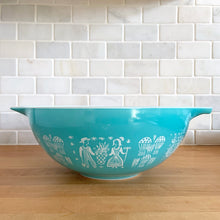 Load image into Gallery viewer, Vintage turquoise Butterprint 444 Cinderella mixing bowl. Crafted by PYREX, USA, 1957 - 1968. A true kitchen classic!

In very good vintage condition, scratches to the exterior, but otherwise no chips and shiny. Doesn&#39;t appear to have been used as there are no utensil marks on the interior.

Measures 13 x 4 1/2 inches

Capacity 4 quarts
