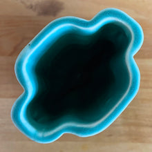 Load image into Gallery viewer, Vintage Art Deco turquoise vase 105 features a unique shape and double leaf decorative handles. Crafted by McCoy Pottery, 1940s. This rare piece is must for any art pottery collector! A lovely way to enhance your home&#39;s decor or give as a gift!

In excellent vintage condition, no chips/cracks/repairs. Typical age-related crazing, manufacturer&#39;s glaze pops. Unmarked.

Measures 4 x 2 1/8 x 5 1/2 inches
