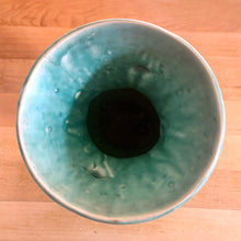 Load image into Gallery viewer, Vintage Art Deco gloss turquoise Peacock handled vase with birds and botanicals. Crafted by McCoy Pottery, 1948. This rare piece is must for any McCoy art pottery collector!

In as found vintage condition, repaired chipped at the rim, chip at the room and crazing commensurate with age. Maker&#39;s mark.

Measures 4 5/8 x 8 1/8 inches
