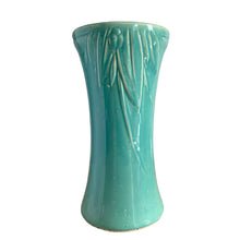 Load image into Gallery viewer, Beautiful vintage large turquoise trumpet vase with embossed leaves and berries at the rim. Crafted by McCoy Pottery, 1930s. This substantially sized vase is must for any art pottery collector!

In excellent vintage condition, no chips/cracks/repairs, manufacturers glaze pops, with age-related crazing. Unmarked.

Measures 7 1/4 x 14 inches
