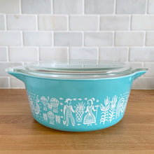 Load image into Gallery viewer, Rear view of vintage PYREX Butterprint 475-B casserole dish with glass lid in place, showing full round form and pattern detail
