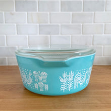 Load image into Gallery viewer, Side view of vintage turquoise PYREX Butterprint 475-B casserole dish without lid, showing depth and tab handles
