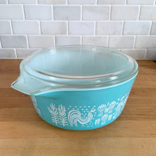 Load image into Gallery viewer, Vintage PYREX Butterprint Model 475-B casserole dish with lid, three-quarter view showing white on turquoise exterior
