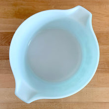 Load image into Gallery viewer, Overhead view of vintage turquoise PYREX Butterprint 475-B casserole dish without lid, showing white Opalware interior and tab handles
