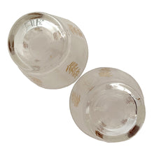 Load image into Gallery viewer, Vintage 2-part glass condiment server featuring alternating 22kt gold leaves and clear leaves on a white stripe and pinecone embossed aluminum lids in chrome caddy. Crafted by Dominion Glass, Canada, 1950s. Love the conical shape of the glass and the styling on the caddy....very mid-century modern and a great way to serve your favourite fixings.

In excellent condition, no chips.

Overall measures 7 3/4 x 4 x 5 1/2 inches
