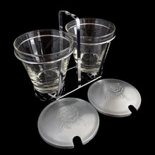 Load image into Gallery viewer, Vintage 2-part glass condiment server with rose embossed aluminum lids in a chrome caddy. Crafted by Dominion Glass, Canada, 1950s. Love the conical shape of the glass and the styling on the caddy....very mid-century modern and a great way to serve your favourite fixings.

In excellent condition, no chips.&nbsp;

Overall measures 7 x 3 1/2 x 5 3/8 inches
