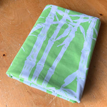 Load image into Gallery viewer, Vintage Ultracale Bamboo flat queen poly cotton sheet featuring a pattern of white bamboo botanicals on green. Crafted by Wamsutta, USA, 1977. A beautiful addition to your Hollywood Regency retro bedding decor or repurpose for crafting.

In excellent vintage condition, no stains/tears.

Measures 108 x 98 inches
