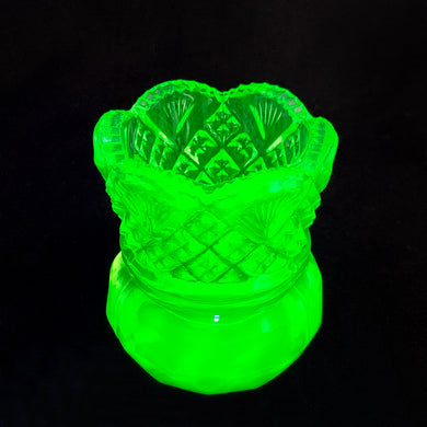 Beautiful pressed uranium glass toothpick holder featuring a diamond fan pattern and sawtooth scalloped edge. Crafted by Westmoreland Glass, USA, circa 1940. This sweet piece of glass glows beautifully under black light. Perfect to hold toothpicks or use as a wee vase!  In excellent condition, free from chips/cracks.  Measures 2 x 2 5/8 inches