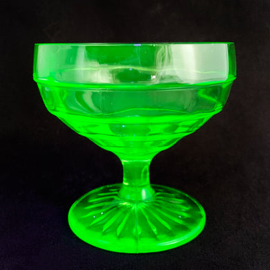 The words 'stunning' and 'elegant', simply don't do justice in describing this depression era art deco style uranium pressed glass 