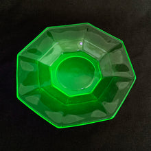 Load image into Gallery viewer, A  vintage depression era uranium glass &quot;Octagon Green&quot; saucer. Crafted by US Glass in the USA, circa 1930s. The saucer features a tiered octagon shape . This piece glows brilliantly under black light. The perfect addition to your uranium glass collection to display or use as a trinket dish!  In used vintage condition, free from chips/cracks. Maker&#39;s mark on the bottom.  Measures 5 1/2 inches
