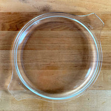 Load image into Gallery viewer, Top-down view of clear PYREX 474-C glass lid showing "PYREX" and "474-C" embossed text on handle tabs
