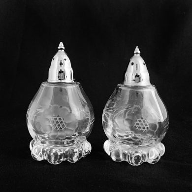 The prettiest pair of Candlewick Corn Flower salt and pepper shakers, cut by WJ Hughes in Canada on on Imperial Glass blanks with chrome lids. Circa 1960/70s. Perfect for serving candy, nuts or condiments. Easily repurpose as a catchall or decor piece.  In excellent condition, free from chips/cracks and looks brand new!  Measures 5-1/2