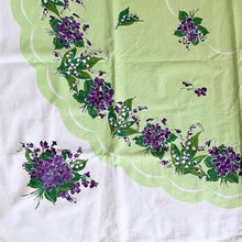 Load image into Gallery viewer, This vintage cotton tablecloth features a central scalloped apple green medallion bordered in white with beautiful purple violets on a white and green background. An elegant and traditional accent for any décor, made from high quality cotton.  In excellent condition.  Measures 50 x 47 1/2 inches
