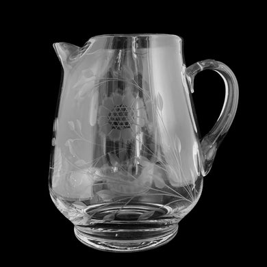 Elegant vintage cut Corn Flower clear glass pitcher with 3 sets of 12-petalled corn flowers and leaf sprays, with applied blown glass open handle on shape 131/100 West Virginia Specialty Blank, cutting by WJ Hughes, Canada, 1960s/70s. This elegant pitcher will elevate any tablescape, fill with your favourite beverage an enjoy!

In excellent condition, free from chips/cracks.

Measures 6 3/4 x 8 1/8 inches tall

Capacity 80 ounces