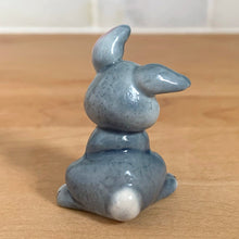 Load image into Gallery viewer, Delightful vintage Disney Thumper Rabbit porcelain figurine, Hat Box Series, Set 2. Wade Whimsies, England, 1950s/60s. Add this sweet figurine to your collection!

In excellent condition, no chips/cracks.

Measures 1 3/8 x 1 x 1 7/8 inches
