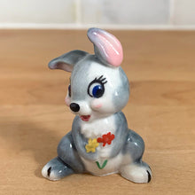 Load image into Gallery viewer, Delightful vintage Disney Thumper Rabbit porcelain figurine, Hat Box Series, Set 2. Wade Whimsies, England, 1950s/60s. Add this sweet figurine to your collection!

In excellent condition, no chips/cracks.

Measures 1 3/8 x 1 x 1 7/8 inches
