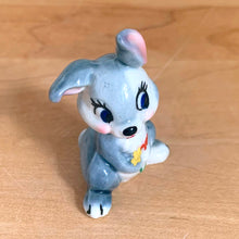 Load image into Gallery viewer, Delightful vintage Disney Thumper Rabbit porcelain figurine, Hat Box Series, Set 2. Wade Whimsies, England, 1950s/60s. Add this sweet figurine to your collection!

In excellent condition, no chips/cracks.

Measures 1 3/8 x 1 x 1 7/8 inches
