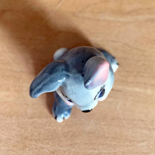 Load image into Gallery viewer, Delightful vintage Disney Thumper Rabbit porcelain figurine, Hat Box Series, Set 2. Wade Whimsies, England, 1950s/60s. Add this sweet figurine to your collection!

In excellent condition, no chips/cracks.

Measures 1 3/8 x 1 x 1 7/8 inches
