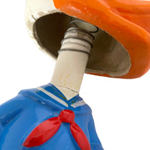 Load image into Gallery viewer, Vintage Walt Disney World Donald Duck paper mache bobble head nodder figurine. Crafted in Japan, 1960s (likely manufactured by Ardco). This beloved collectible along with its nodding head figurine adds a whimsical touch to any room or display. A must-have for any Disney enthusiast. This is a great opportunity for a Disney fan to own a piece of history and to add to their collection.
