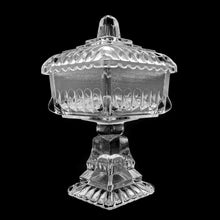 Load image into Gallery viewer, Vintage clear pressed glass lidded wedding box. Produced by Jeannette Glass, USA, circa 1950s. A lovely piece to use as a candy or trinket dish.  In used vintage condition, minor flea bites to the interior rim of the lid....barely noticeable and typical for a piece of this age.  Measures 4 1/2 x 4 1/2 x 7 1/2 inches
