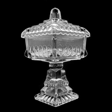 Vintage clear pressed glass lidded wedding box. Produced by Jeannette Glass, USA, circa 1950s. A lovely piece to use as a candy or trinket dish.  In used vintage condition, minor flea bites to the interior rim of the lid....barely noticeable and typical for a piece of this age.  Measures 4 1/2 x 4 1/2 x 7 1/2 inches