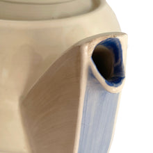 Load image into Gallery viewer, Vintage Art Deco style Wedding Ring coffee set in the blue, rust and gray colourway. Crafted by Susie Cooper, England, 1930s. This kestrel-shaped set comprised of a coffee pot with lid, creamer and sugar with four demitasse cups and saucers.

The set is in generally good vintage condition with no chips, cracks, or repairs. Each piece shows age-related crazing. The coffee pot has a chip at the top of the spout, and the sugar bowl has staining on the bottom. All pieces have maker's marks.
