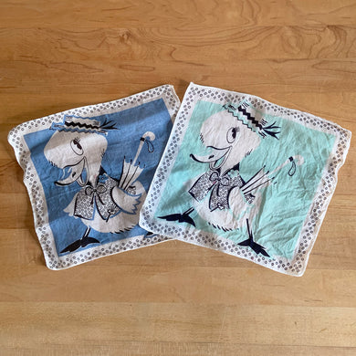 Whimsical vintage child handkerchiefs in blue and aqua with cartoon of an anthropomorphized duck with umbrella. 1940s.

In good vintage condition, no tears/stains.

Measures 8 1/4 x 7 3/4 inches
