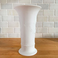 Load image into Gallery viewer, A delicate and elegant art nouveau style white bisque flower vase featuring embossed floral design and glazed on the inside. Marked 384/20. Crafted by Kaiser, Germany. In excellent condition, free from chips/cracks/repairs. Measures 5 x 8 inches
