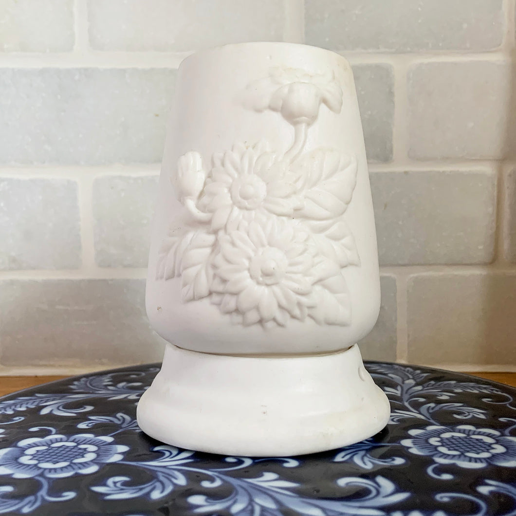 Pretty vintage white bisque ceramic two piece fairy lamp with embossed floral design. Create a beautiful ambient glow with this piece.  In excellent condition, free from chips/cracks/repairs.  Measures 3 3/16 x 4 1/2 inches