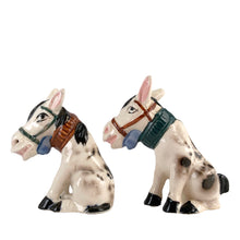 Load image into Gallery viewer, Vintage hand painted white and black donkey ceramic salt and pepper shakers with corks. Japan, 1950s. Add these unique shakers to your collection!

In excellent vintage condition, no chips/cracks/repairs. Unmarked

Measures 3 1/2 x 1 3/4 x 4 inches
