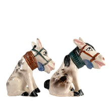 Load image into Gallery viewer, Vintage hand painted white and black donkey ceramic salt and pepper shakers with corks. Japan, 1950s. Add these unique shakers to your collection!

In excellent vintage condition, no chips/cracks/repairs. Unmarked

Measures 3 1/2 x 1 3/4 x 4 inches
