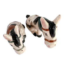 Load image into Gallery viewer, Vintage hand painted white and black donkey ceramic salt and pepper shakers with corks. Japan, 1950s. Add these unique shakers to your collection!

In excellent vintage condition, no chips/cracks/repairs. Unmarked

Measures 3 1/2 x 1 3/4 x 4 inches
