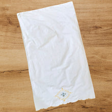 Load image into Gallery viewer, Lovely white cotton single vintage pillowcase hand embroidered with blue flowers inside a yellow medallion and a scalloped opening finished in yellow. Freshly laundered and steamed flat. Excellent condition, free from stains/tears. 18 1/2 x 31 1/2 inches
