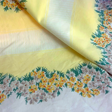 Transform your dining space into an elegant oasis with this vintage white cotton rectangular tablecloth printed with a lemon yellow inset striped border surrounded by intricate floral borders in shades of yellow, orange, gray and green. Crafted from high-quality cotton, this tablecloth seamlessly combines beauty and durability. Elevate your dining experience today with this timeless classic mid-century era textile!

In excellent condition, no stains or tears.

Measures 52 x 64 inches
